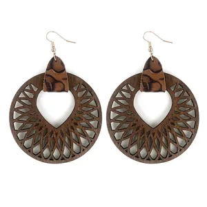 Boucles d'oreilles pendantes mandala creuses en bois vintage avec connecteur en cuir leopard.