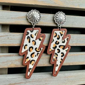 Western style lightning shape earrings with leopard print genuine leather and wood frame details.