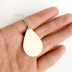 Close-up view of lightweight teardrop wooden blank earring with silver metal hook showing detail.