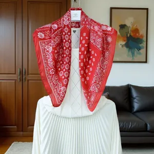 Red silk scarf with classic paisley print, elegant square design, 70x70cm lightweight silky accessory.