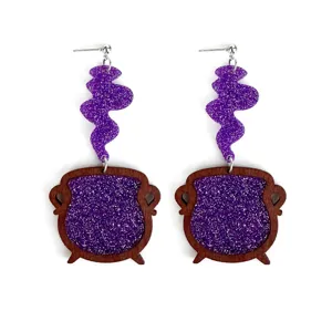 Close-up detail of Halloween witch cauldron earrings with purple glitter wood and silver post.