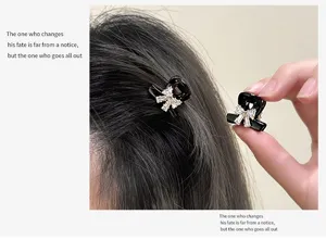 Exquisite mini rhinestone bow hair claw clip for women, stylish black hair accessory.