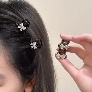 Small rhinestone bow hair claw clips, perfect for bangs and sweet daily hairstyles.