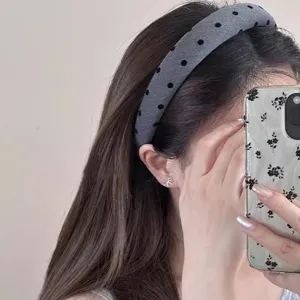 Korean style wide polka dot headband for women, stylish daily hair accessory detail view.