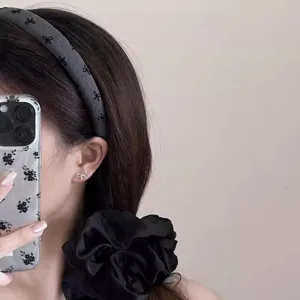 Korean style wide bow headband detail shot showing elegant dark grey hair hoop and accessories.
