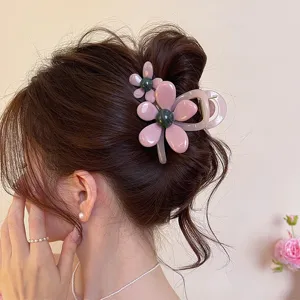 Korean style pink flower hair claw clip for women, elegant resin shark clip for hair styling.