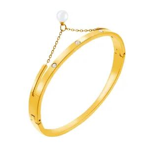 Chic gold titanium steel bangle with pearl tassel and sparkling crystal details for women.