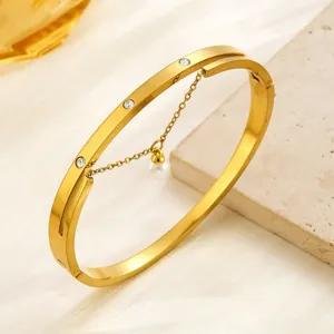 Elegant titanium steel bangle with crystals and pearl tassel, women light luxury jewelry.