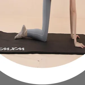 Detailed view of grey non-slip yoga toe socks on a mat for pilates and balance sports.
