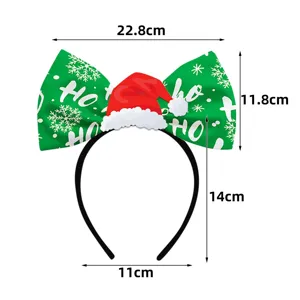 Christmas party bow headband detail view, green bow and mini Santa hat design for holiday dress.