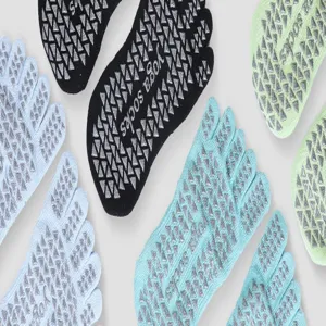 Non-slip five toe yoga socks detail, grip dots on sole for pilates and barefoot sports balance.