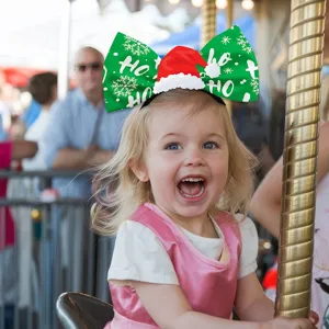 Christmas bow headband with mini Santa hat, festive holiday hair accessory for kids and adults.
