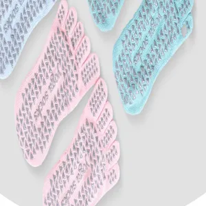 Detail view of five-toe yoga socks with anti-slip grip dots on the sole for women sports.