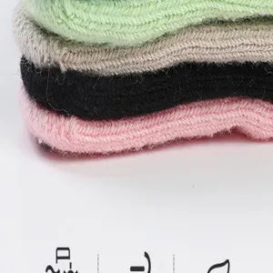 Detailed view of women's five-finger yoga socks in assorted colors. Soft knit material.