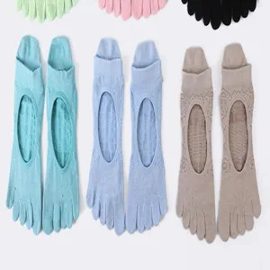 Detail view of five-toe yoga socks, breathable open-back design, comfortable pilates grip socks.