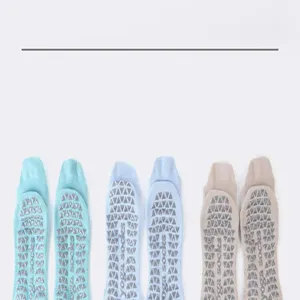 Detailed view of women's five-toe yoga socks with anti-slip grip dots on the sole.
