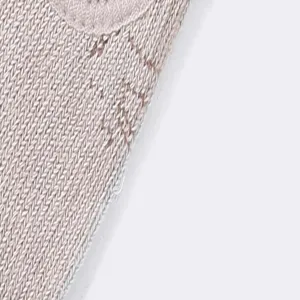 Detailed view of women knitted yoga socks fabric, breathable texture, soft and comfortable.