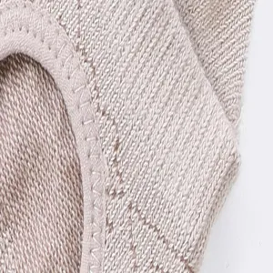 Detailed view of women's five-toe yoga socks, featuring soft knit fabric and fine stitching.