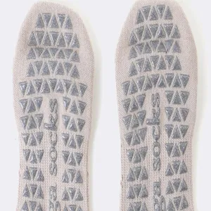 Detailed sole view of women yoga socks with anti-slip silicone grip dots for stability.