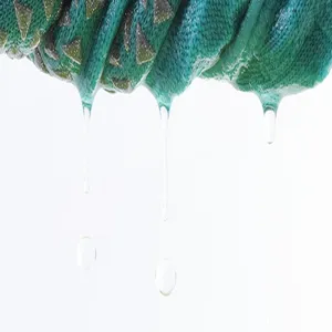 Non-slip yoga socks detail close-up, breathable knitted fabric with grip dots and water effect.