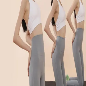 Detailed view showcasing high-waisted grey yoga leggings and white sports top set.