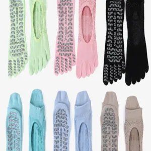 Detailed view of women's five toe non slip yoga socks featuring breathable cotton fabric.