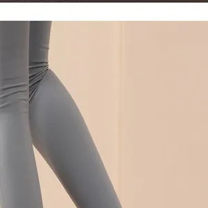 Close-up detail shot of women's grey athletic leggings, showing soft fabric texture and fit.