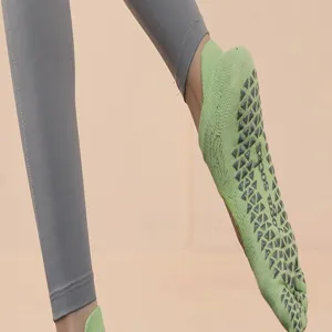 Detailed view of women five toe non slip yoga socks with grip dots for pilates fitness.
