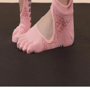 Pink five toe yoga socks with non slip grips for pilates, breathable open back sports socks.