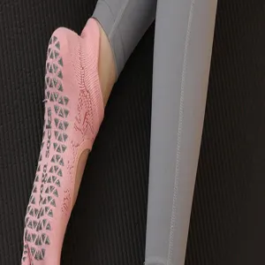 Pink non-slip yoga socks with grip dots detail view for women fitness pilates wear