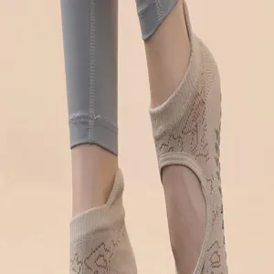 Beige non-slip pilates yoga socks detail displaying woven texture and rubber grip dots.