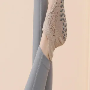 Detailed view of women non-slip yoga socks with grip dots for pilates and fitness sports.