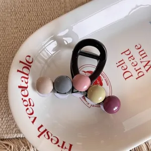Detailed view of the colorful bead medium hair claw clip, elegant styling accessory for women.