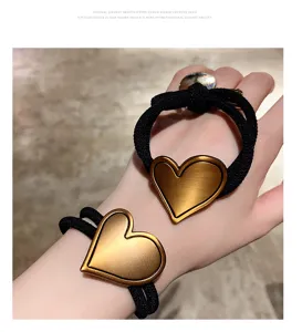 Stylish metal heart hair tie set, black elastic rubber band for women daily ponytail styling.