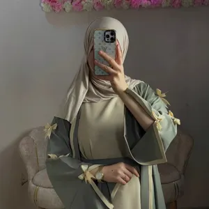Women elegant loose long abaya cardigan with bow ties, stylish modest fashion outer wear main view.