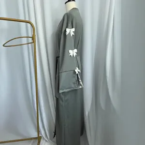 Elegant grey long robe for women featuring chic white bow decorations on the sleeves.
