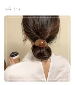 Minimalist amber acetate hair ring, elegant bun and ponytail holder for stylish daily wear.