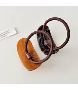 Detailed view of minimalist resin geometric hair tie with elastic rubber band, stylish.