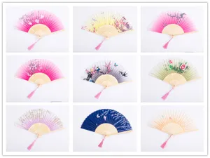 Detailed view showcasing various styles of folding hand fans with traditional floral silk patterns.