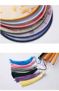 Traditional Chinese classical round fan with wooden handle and colorful tassel pendant details.