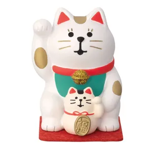 Detailed view of cute Japanese lucky cat resin ornament, mini desktop decor figure, fine craftsmanship.