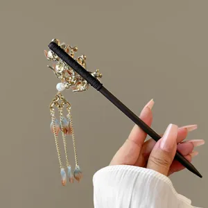 Traditional Chinese style wooden hair stick with golden floral tassel drop for Hanfu dress.