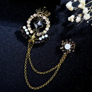 Vintage crown star tassel brooch detail, gold metal rhinestone crystal jewelry, elegant accessories.