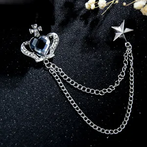 Retro court style gem brooch with crown and chains, exquisite detail for evening dress.
