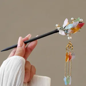 Chinese wooden hair stick with colorful floral petals and hanging tassels for Hanfu styling.