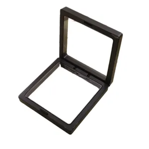 Schwarze schwebende Schmuck-Display-Box mit transparenter PE-Folie für Ringe und Broschen.