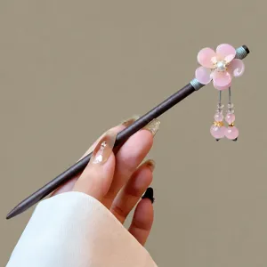 Traditional Chinese wooden hairpin with pink flower tassel, elegant retro hair stick for women.