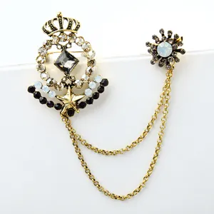 Exquisite vintage court style rhinestone brooch detail showing exquisite crown and crystal charms.