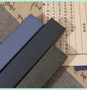Detailed view of traditional Chinese folding fan gift boxes, elegant fabric and brocade design.