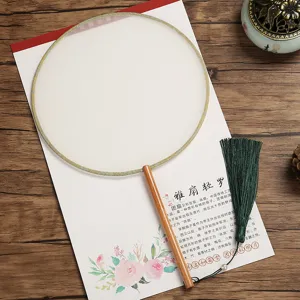 Traditional Chinese blank round silk fan with long wooden handle and green tassel for DIY painting.